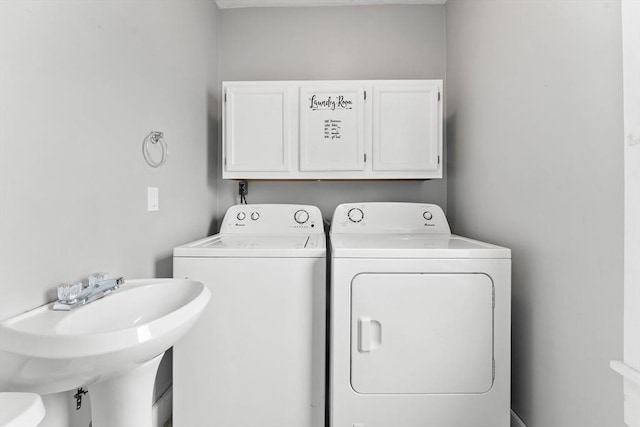 laundry area with washer and dryer and sink