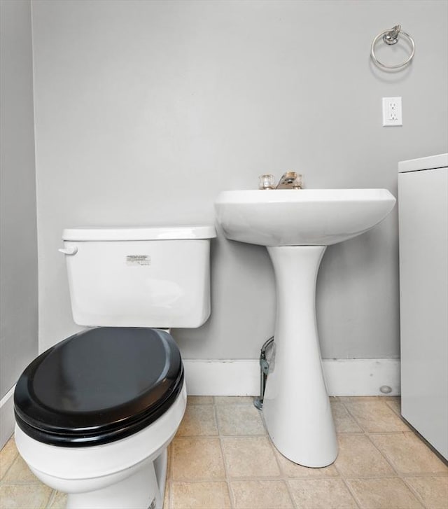 bathroom with tile patterned floors and toilet