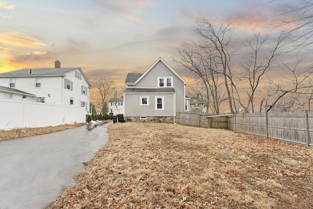 view of property exterior at dusk