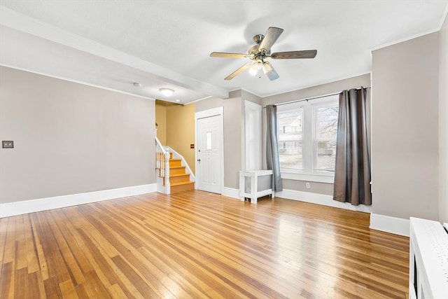 spare room with ceiling fan and light hardwood / wood-style floors