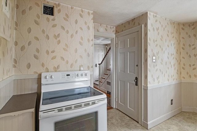 kitchen featuring white electric stove