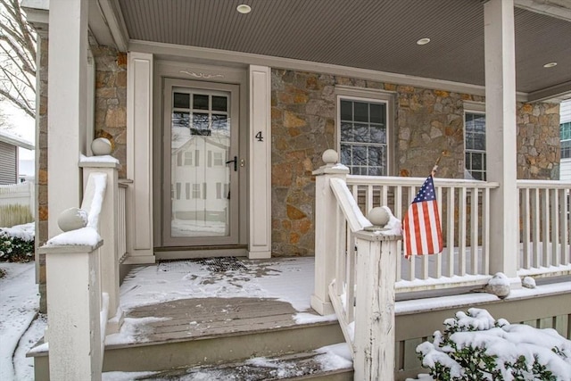 view of snow covered property entrance