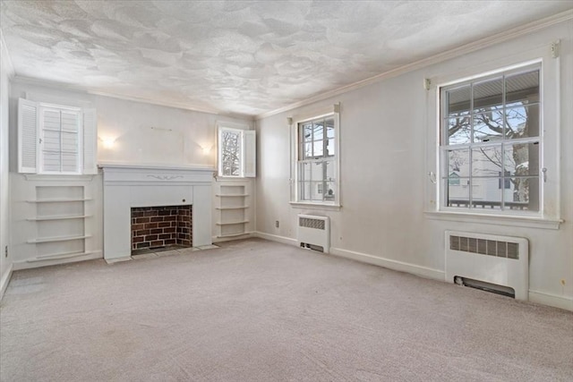 unfurnished living room with built in shelves, light carpet, radiator, and crown molding