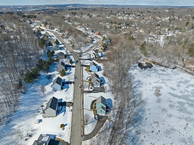 snowy aerial view featuring a residential view