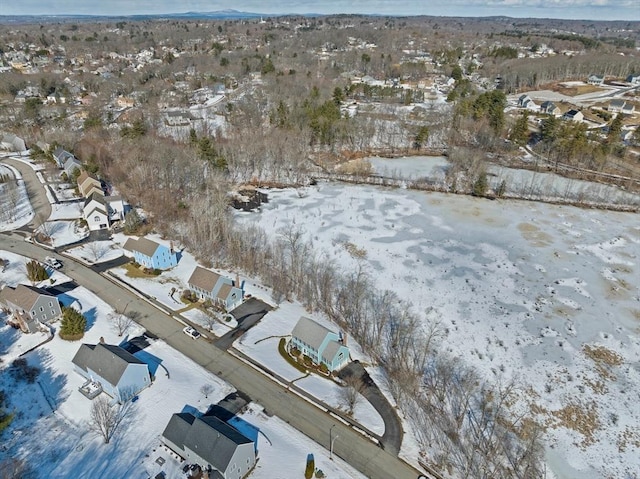 snowy aerial view with a residential view