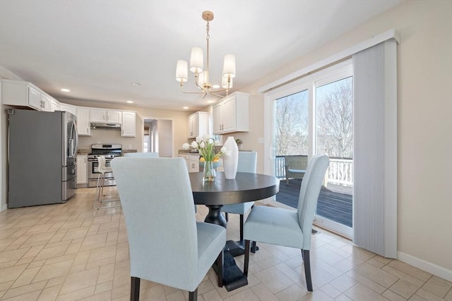 dining room with an inviting chandelier, baseboards, and recessed lighting