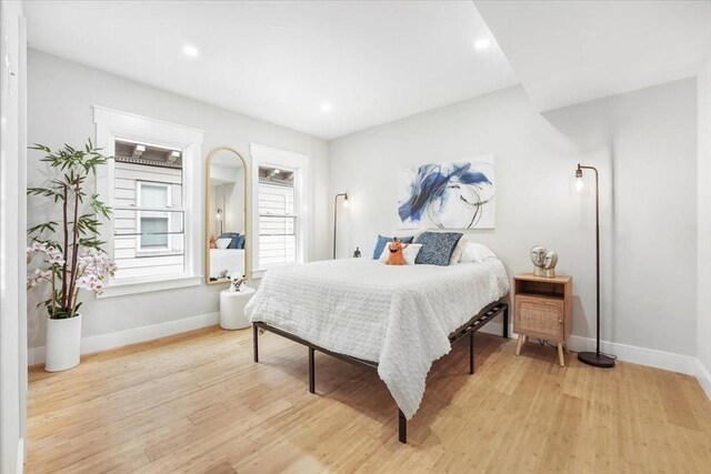 86 Cypress St Unit 8-6, Watertown, MA 02472 - bedroom with baseboards, light wood-style floors, and recessed lighting