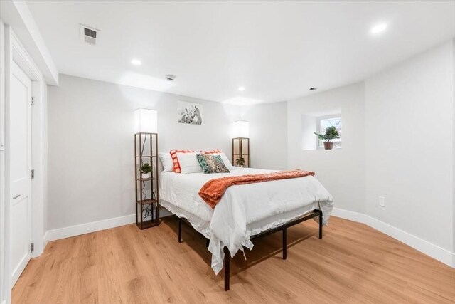 86 Cypress St Unit 8-6, Watertown, MA 02472 - bedroom with light wood-type flooring, baseboards, and recessed lighting