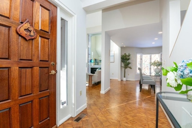 entrance foyer featuring light parquet flooring