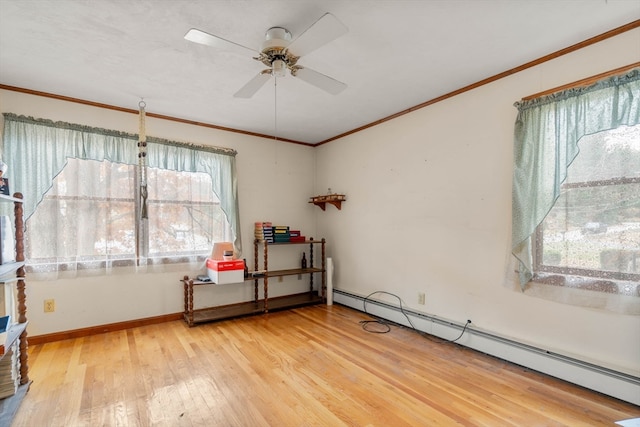 interior space featuring ornamental molding, hardwood / wood-style floors, a baseboard radiator, and ceiling fan