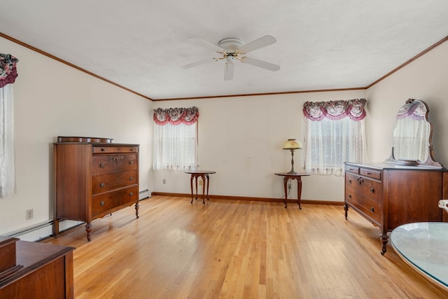 sitting room featuring ceiling fan, plenty of natural light, light hardwood / wood-style flooring, and a baseboard heating unit