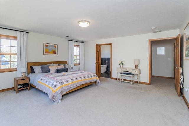 bedroom featuring baseboards, carpet, and visible vents