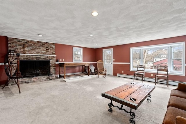 carpeted living room with a fireplace, a textured ceiling, recessed lighting, and baseboard heating