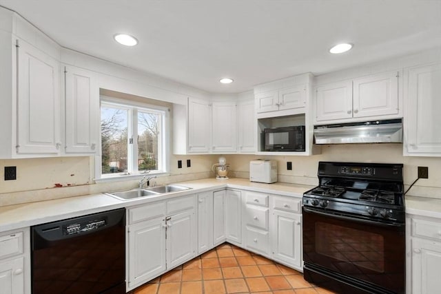 kitchen with white cabinetry, black appliances, a sink, and under cabinet range hood