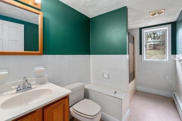 bathroom with a baseboard radiator, toilet, an enclosed shower, and a textured ceiling