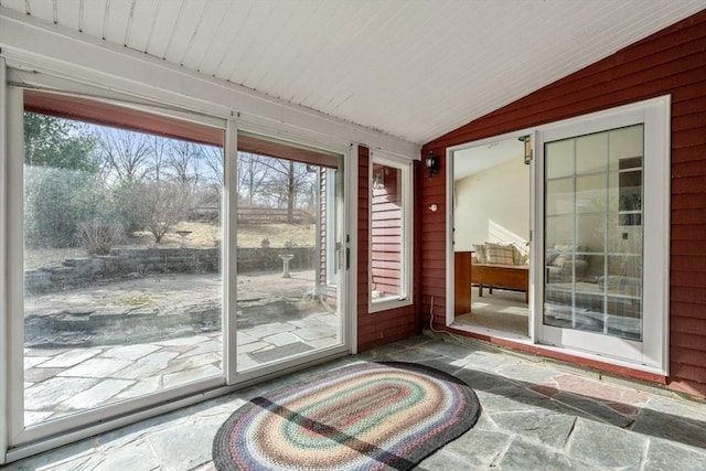 entryway with lofted ceiling and a wealth of natural light