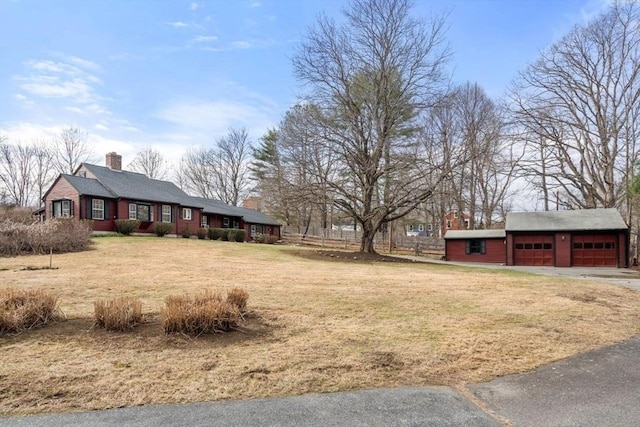 view of yard with an outdoor structure and a garage
