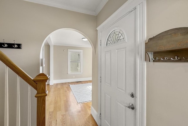 28 Mason, Salem, MA 01970 - entryway featuring arched walkways, ornamental molding, light wood-type flooring, stairway, and baseboards