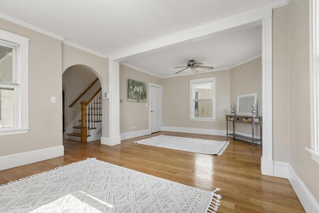 28 Mason, Salem, MA 01970 - foyer with wood finished floors, arched walkways, baseboards, ornamental molding, and a ceiling fan