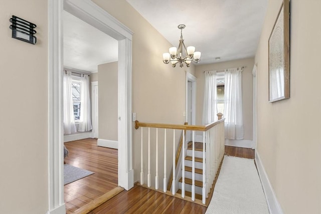 28 Mason, Salem, MA 01970 - hallway with an upstairs landing, wood finished floors, a chandelier, and baseboards