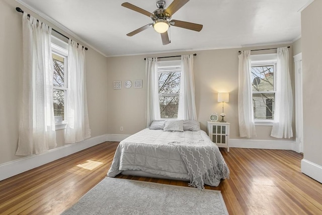 28 Mason, Salem, MA 01970 - bedroom with multiple windows, baseboards, wood finished floors, crown molding, and a ceiling fan