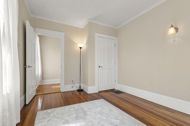 28 Mason, Salem, MA 01970 - unfurnished bedroom featuring wood finished floors, crown molding, and baseboards