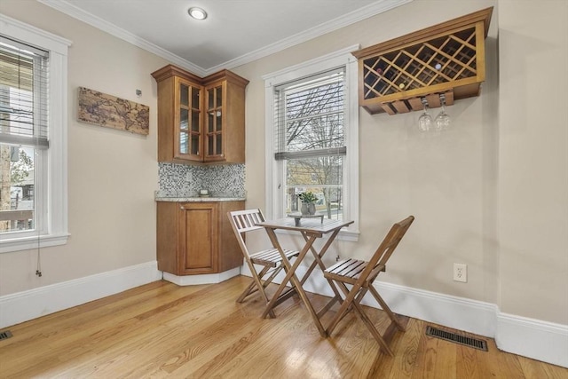 28 Mason, Salem, MA 01970 - dining room featuring light wood-style flooring, baseboards, and crown molding