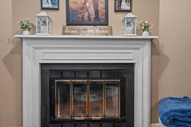 detailed view of a glass covered fireplace