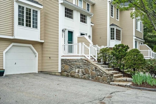 entrance to property with a garage and driveway