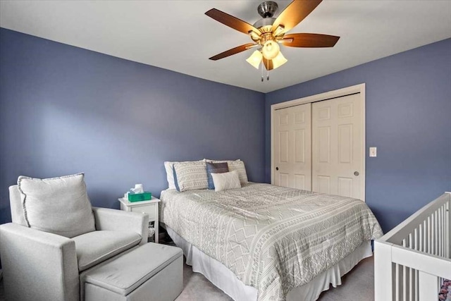 bedroom with carpet flooring, a closet, and a ceiling fan