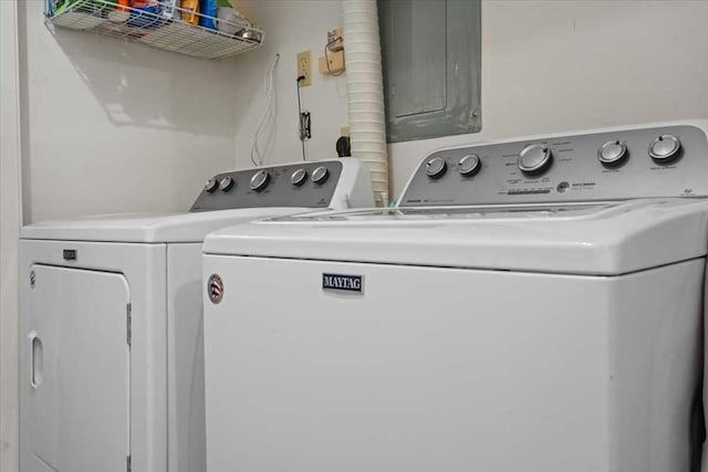 clothes washing area featuring washing machine and dryer