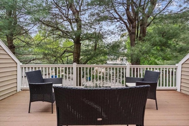 wooden terrace with outdoor dining area
