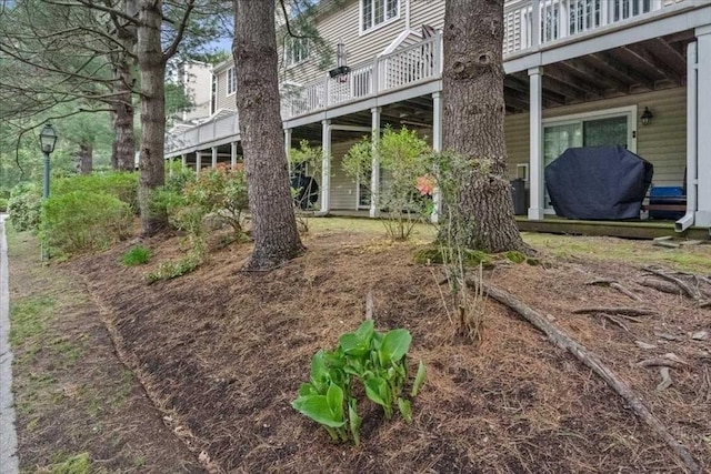 view of yard with a wooden deck