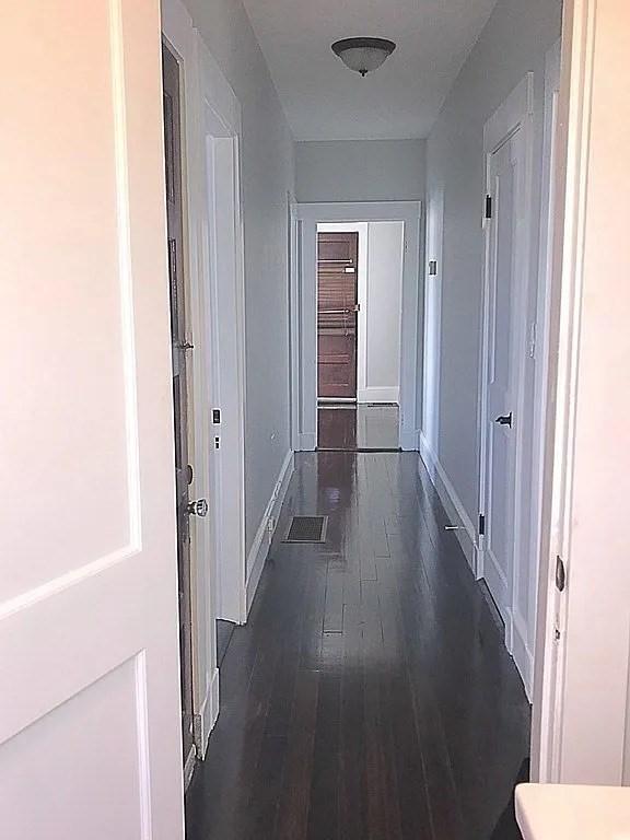 124 Grant Ave, Medford, MA 02155 - hallway with dark wood finished floors and baseboards