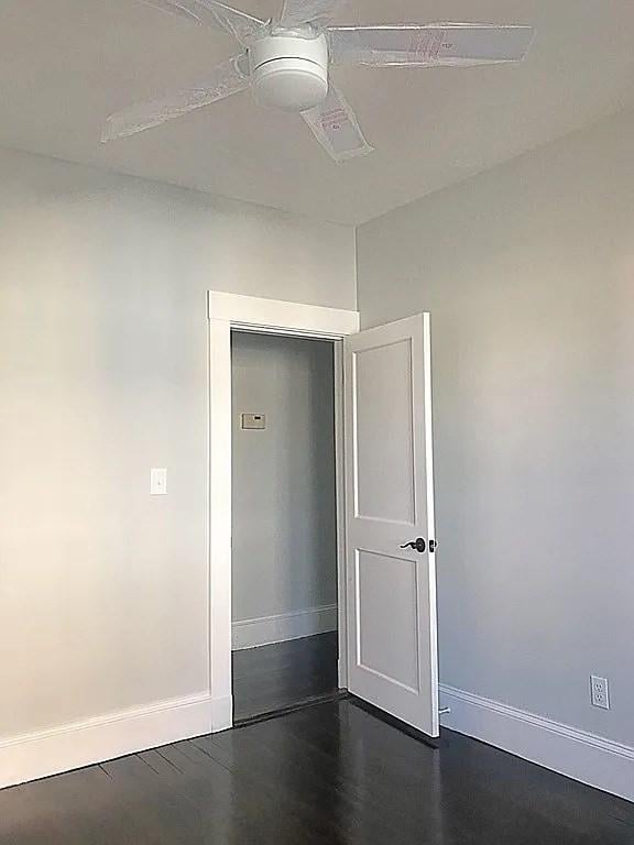 124 Grant Ave, Medford, MA 02155 - unfurnished room with baseboards and dark wood-type flooring