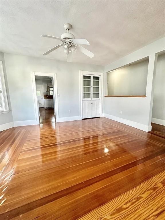 124 Grant Ave, Medford, MA 02155 - spare room featuring ceiling fan, hardwood / wood-style floors, baseboards, and a textured ceiling