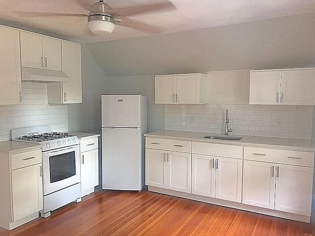 124 Grant Ave, Medford, MA 02155 - kitchen featuring white appliances, a sink, light countertops, tasteful backsplash, and white cabinetry