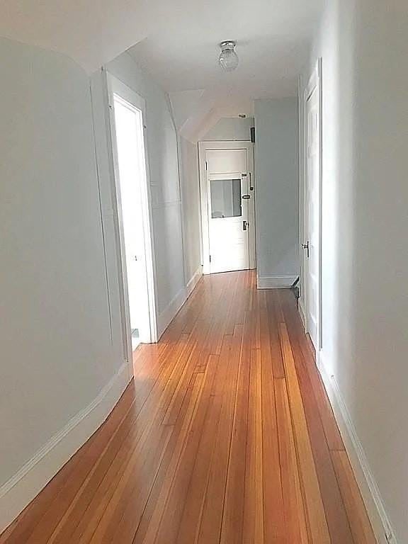 124 Grant Ave, Medford, MA 02155 - hallway with light wood-style floors, baseboards, and vaulted ceiling