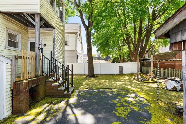 124 Grant Ave, Medford, MA 02155 - fenced backyard with a patio