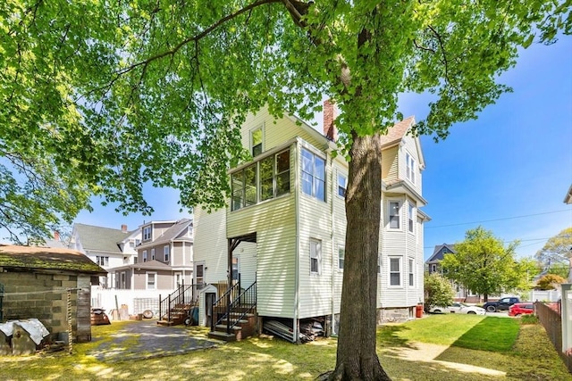 124 Grant Ave, Medford, MA 02155 - back of house with a chimney and a residential view