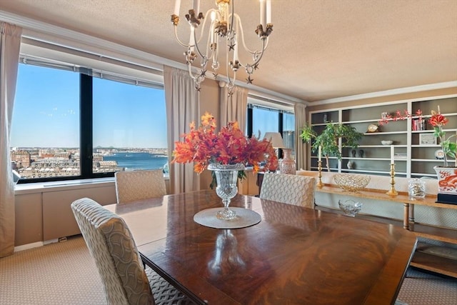 carpeted dining space with a chandelier and a textured ceiling