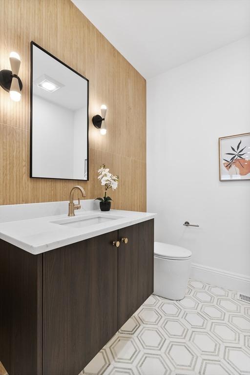 bathroom with toilet and vanity