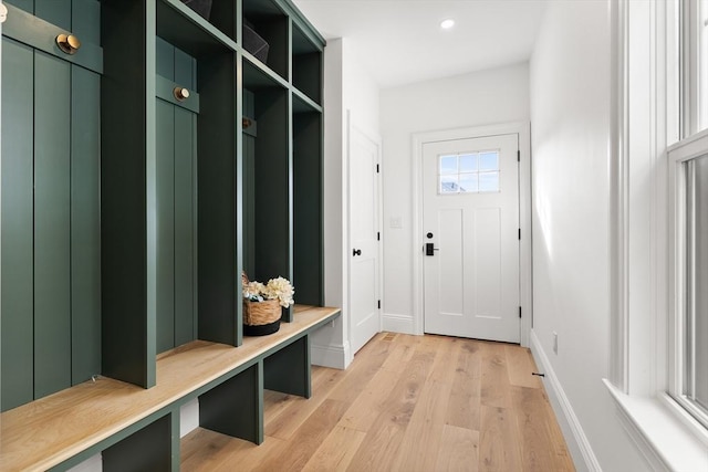 mudroom with light hardwood / wood-style flooring