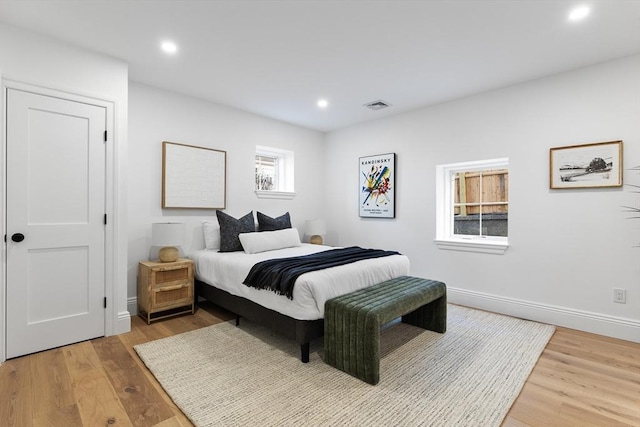 bedroom with hardwood / wood-style flooring