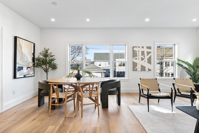 dining area with light hardwood / wood-style flooring