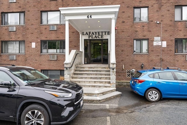 44 Lafayette Ave Unit 404, Chelsea, MA 02150 - view of exterior entry featuring brick siding