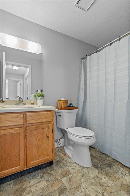 181 Littleton Rd Unit 333, Chelmsford, MA 01824 - full bathroom with toilet, vanity, and a textured ceiling