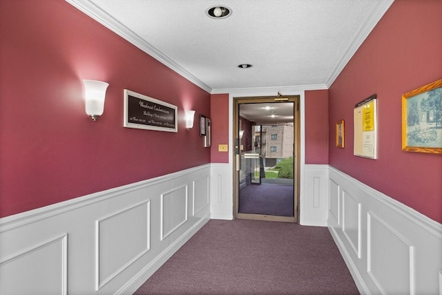 181 Littleton Rd Unit 333, Chelmsford, MA 01824 - hallway featuring a wainscoted wall, a textured ceiling, crown molding, and carpet floors