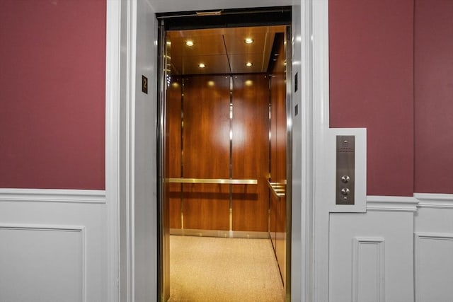 181 Littleton Rd Unit 333, Chelmsford, MA 01824 - elevator with wainscoting and a decorative wall