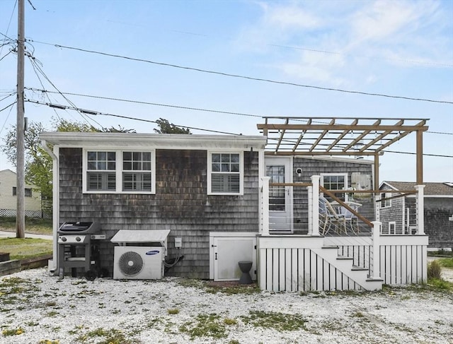 back of property with a cooling unit